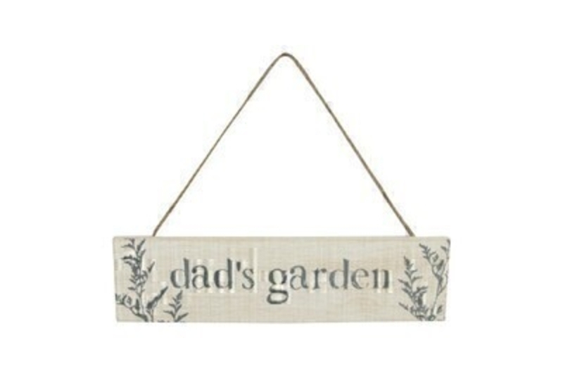 Lightweight wooden sign in natural wood effect with olive green wording Dads Garden printed on and rustic thin rope to hang with. This garden hanging sign is made by the London based designer Gisela Graham who designs really beautiful gifts for your home and garden. Would make an ideal dad gift for a proud gardener.